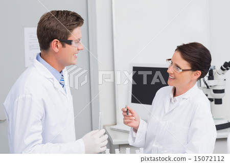 Scientists smiling at each other Scientists smiling at each other 15072112