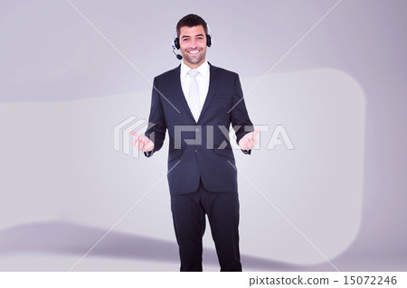 Composite image of businessman wearing headset 15072246