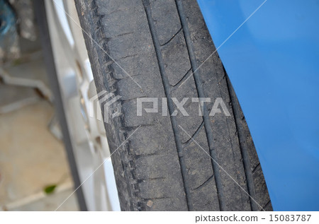 worn tire of a blue car detail photo 15083787
