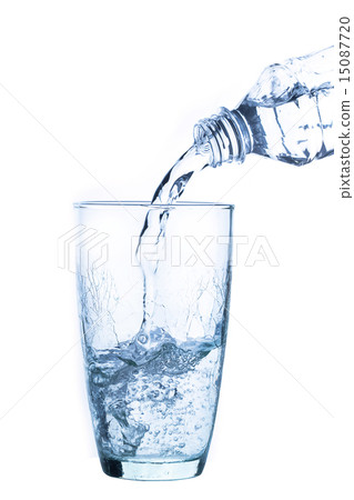 Pouring water into glass on white background Pouring water into glass on white background 15087720
