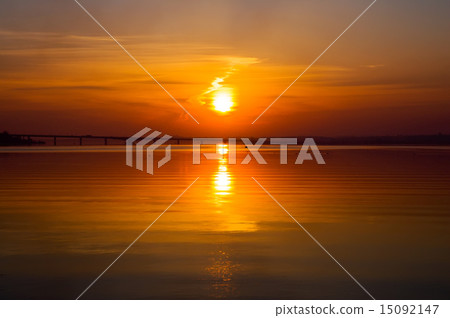beautiful sunset over river with bridge 15092147