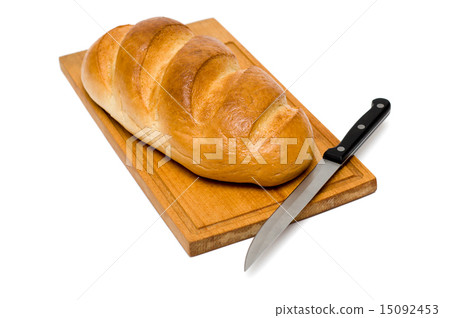 fresh natural bread with knife on breadboard 15092453