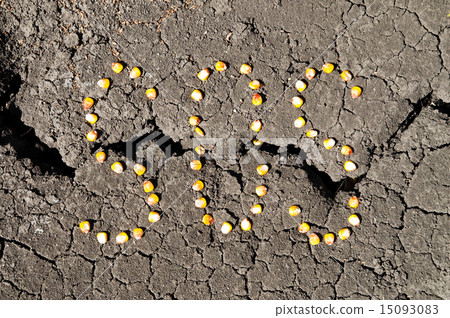 word SOS from grains of corn over cracked earth word SOS from grains of corn over cracked earth 15093083