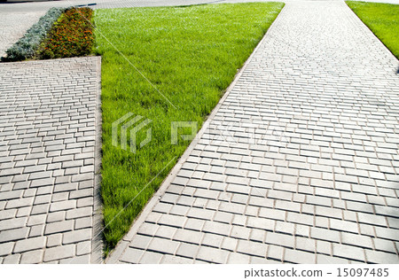 sidewalk between green grass sidewalk between green grass 15097485