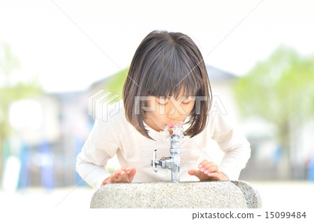 A girl drinking water 15099484