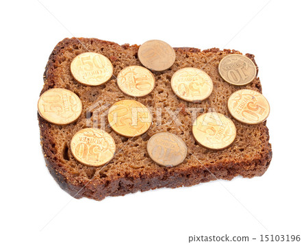 Coins on rye bread slice Coins on rye bread slice 15103196