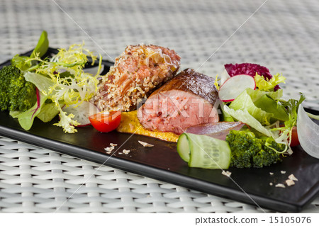 Veal sauce with vegetables on dark plate Veal sauce with vegetables on dark plate 15105076