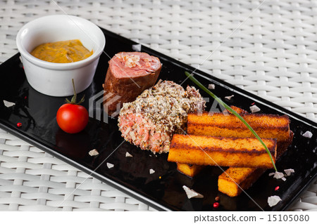 Veal sauce with vegetables on dark plate Veal sauce with vegetables on dark plate 15105080