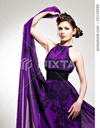 Beautiful fashion woman in purple long dress Beautiful fashion woman in purple long dress 15110890