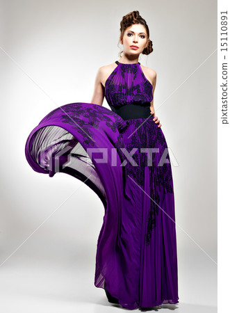 Beautiful fashion woman in violet long dress Beautiful fashion woman in violet long dress 15110891