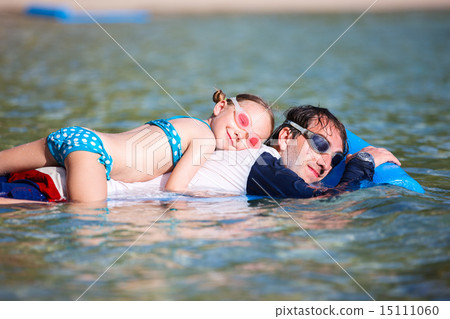 Father and daughter on beach vacation Father and daughter on beach vacation 15111060