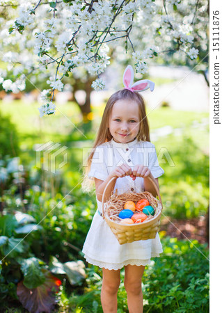 Little girl with Easter eggs Little girl with Easter eggs 15111876