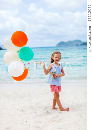 Little girl with balloons at beach Little girl with balloons at beach 15112052