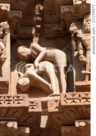 Stone carved erotic sculptures on temple Khajuraho Stone carved erotic sculptures on temple Khajuraho 15114971
