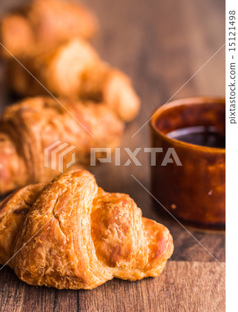 croissant with chocolate , coffee cup croissant with chocolate , coffee cup 15121498