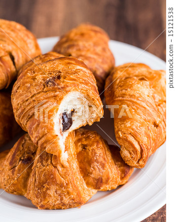 croissants with chocolate on a plate, breakfast 15121538