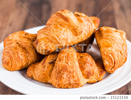 croissants with chocolate on a plate, breakfast 15121539