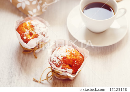 Sweet Fresh Baked Muffins with Cup of Coffee 15125158