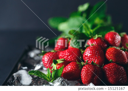 Ripe strawberry on ice with mint leaf 15125167