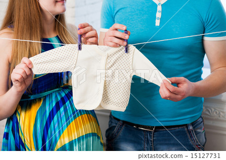 Beautiful young couple expecting baby Beautiful young couple expecting baby 15127731