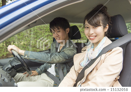 A couple driving A couple driving 15132058