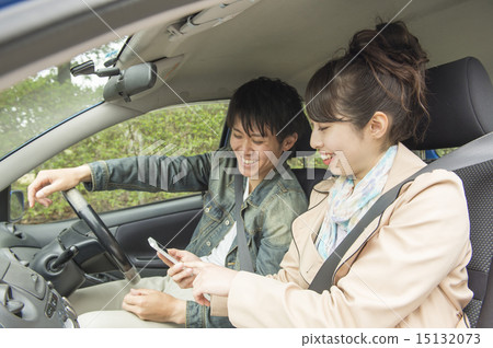 A couple driving 15132073