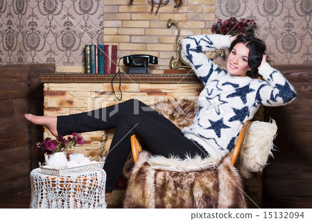 Playful woman sitting on the chair 15132094