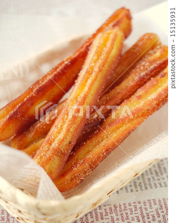 Cinnamon churros basket version (high angle) Cinnamon churros basket version (high angle) 15135931