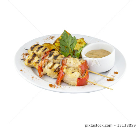 Chicken skewers with potatoes and sauce 15138859