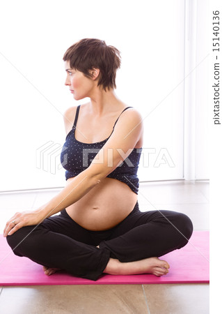 Pregnant woman keeping in shape Pregnant woman keeping in shape 15140136
