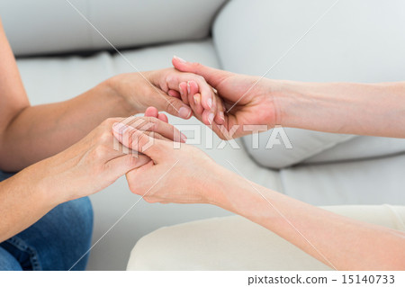 Therapist holding her patients hands 15140733