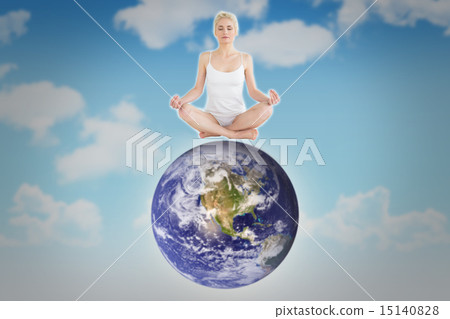 Composite image of toned young woman sitting in lotus pose with 15140828
