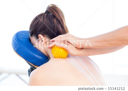 Woman having back massage with massage ball 15141212