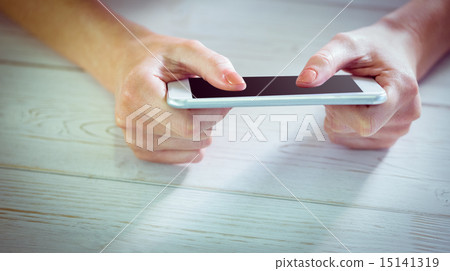Woman using her smartphone Woman using her smartphone 15141319