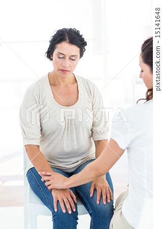 Hypnotized woman with her therapist 15141648