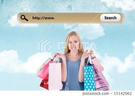 Composite image of pretty young blonde holding shopping bags 15142062