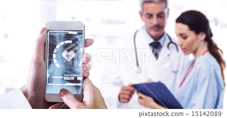 Composite image of hand holding smartphone Composite image of hand holding smartphone 15142089