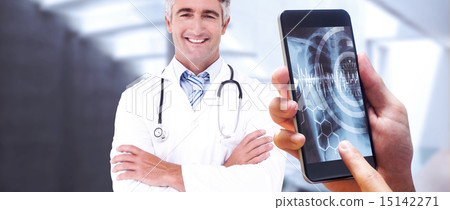 Composite image of hand holding smartphone Composite image of hand holding smartphone 15142271