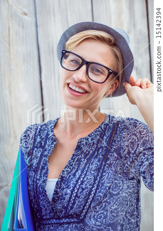 Pretty blonde woman holding folders Pretty blonde woman holding folders 15142394