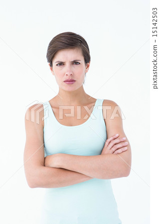 Angry woman looking at camera with arms crossed 15142503