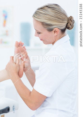 Physiotherapist doing foot massage 15143188