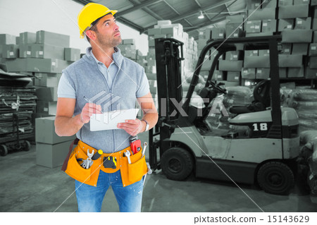 Composite image of manual worker looking away while writing on c Composite image of manual worker looking away while writing on c 15143629