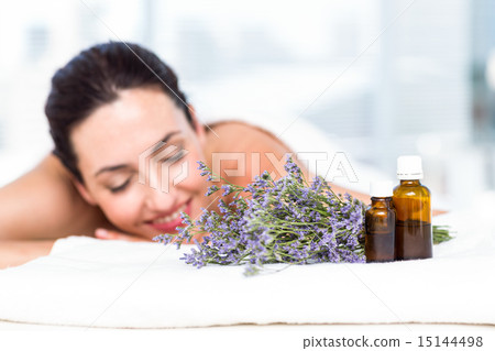 Smiling woman getting an aromatherapy treatment 15144498