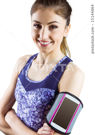 Fit woman using smartphone in armband 15144864