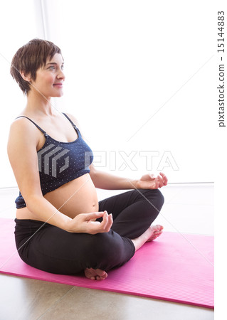 Pregnant woman keeping in shape Pregnant woman keeping in shape 15144883