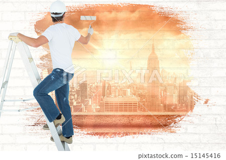 Composite image of man on ladder painting with roller 15145416