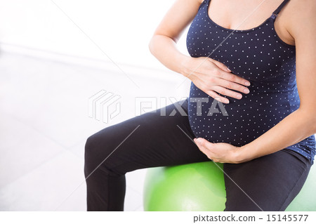Pregnant woman keeping in shape 15145577
