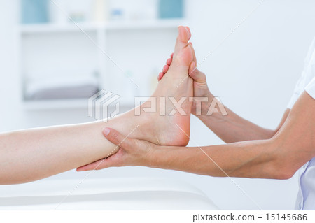 Physiotherapist doing foot massage 15145686