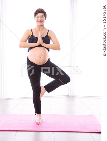 Pregnant woman keeping in shape Pregnant woman keeping in shape 15145866