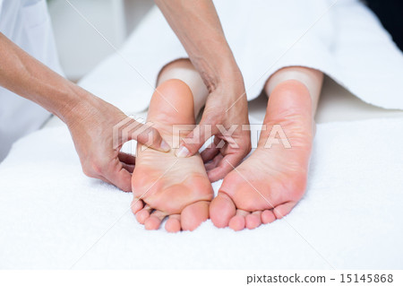 Physiotherapist doing foot massage Physiotherapist doing foot massage 15145868